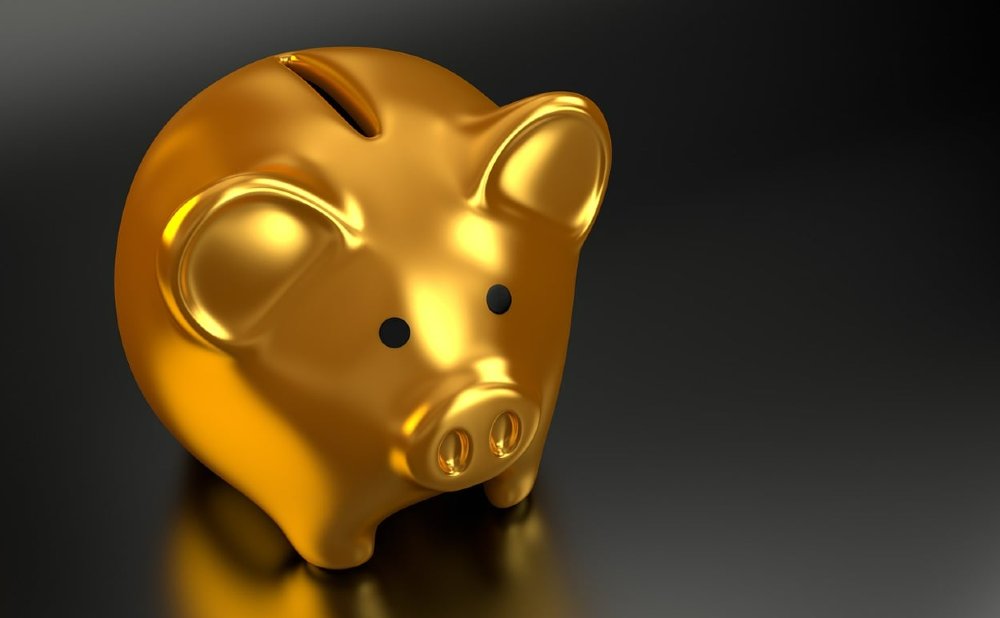 Goldenes Sparschwein auf schwarzem Grund